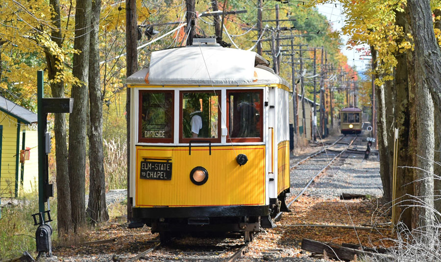 A parade of trolleys on our railway with fall colors